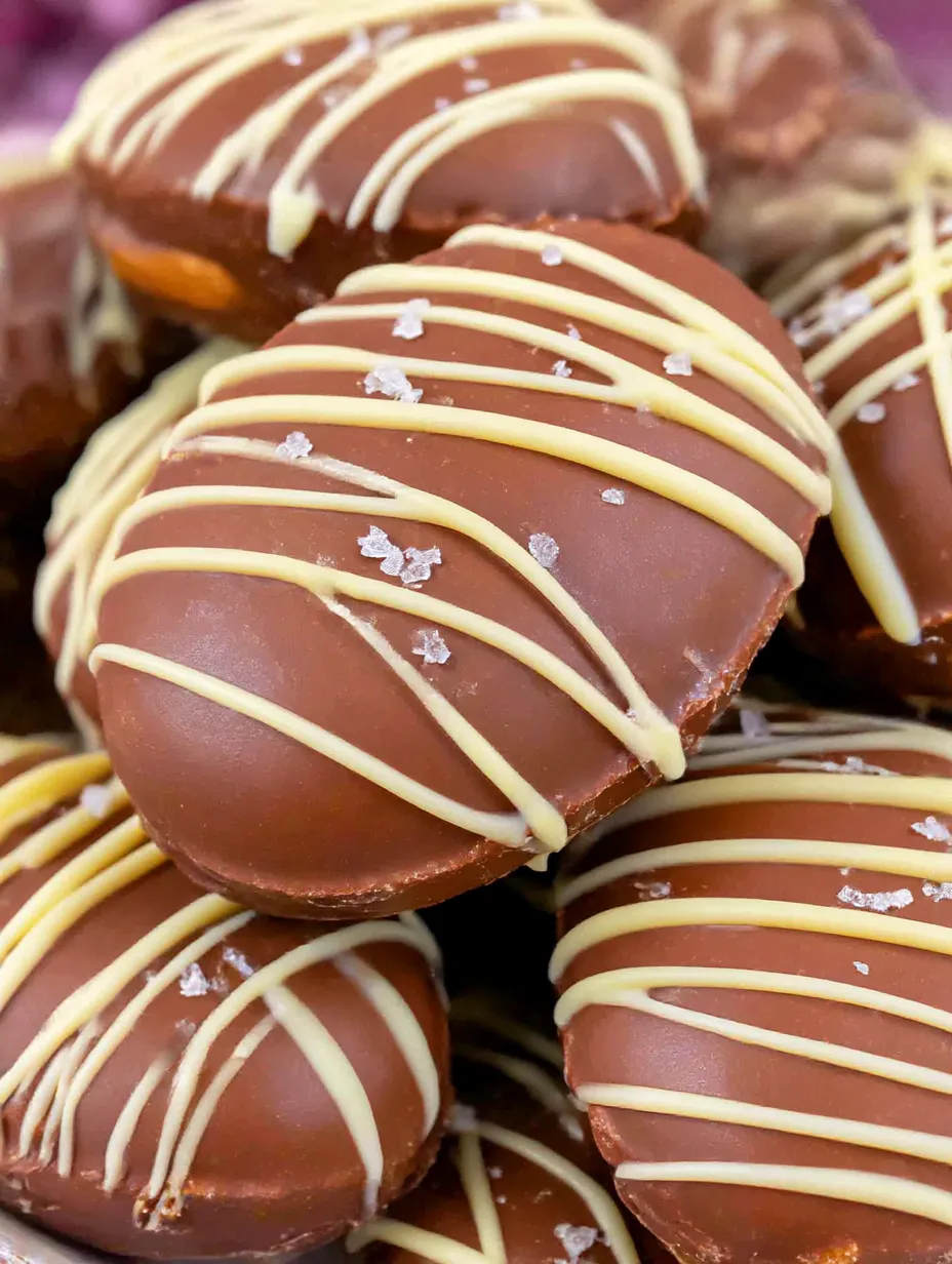 Homemade peanut butter eggs with chocolate and white icing.