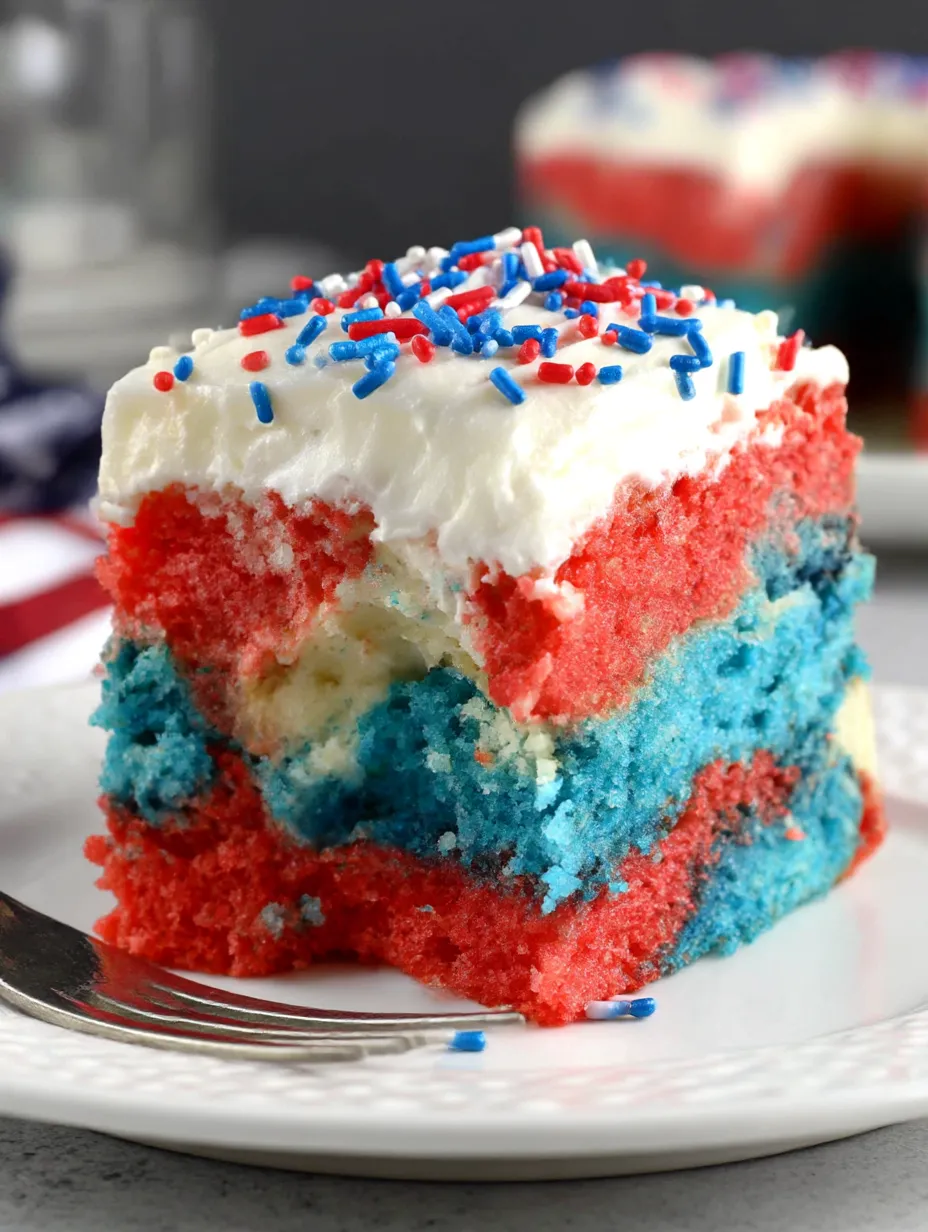 A slice of patriotic poke cake.