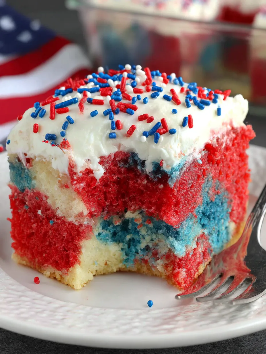 A slice of patriotic poke cake.