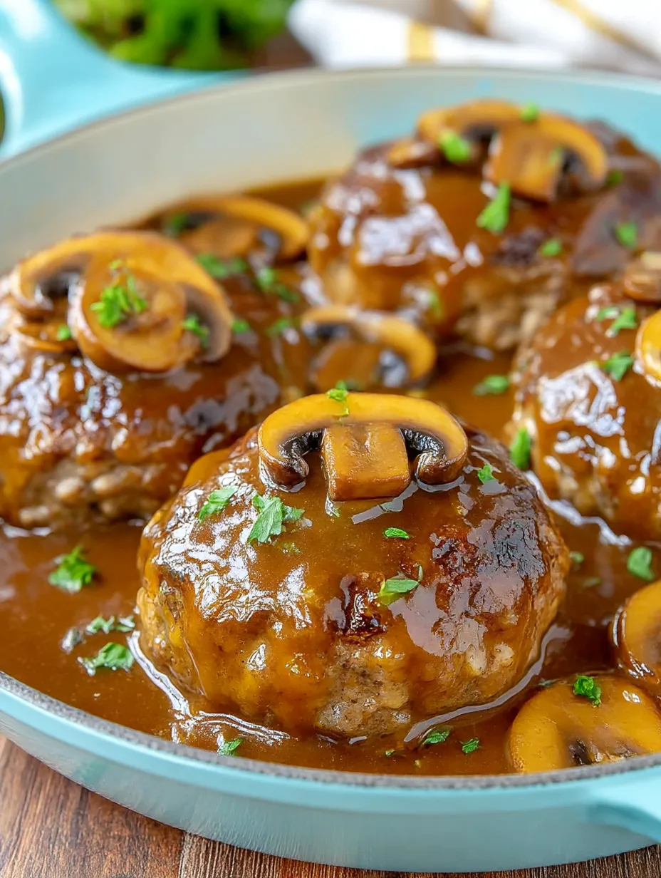 A dish of meatballs covered in gravy.