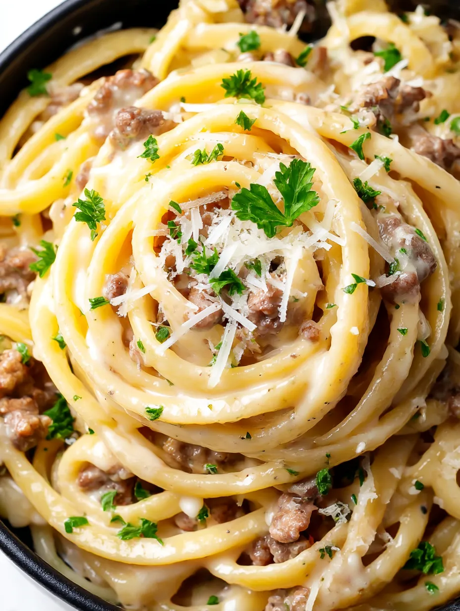 A bowl of pasta with cheese and garlic butter.