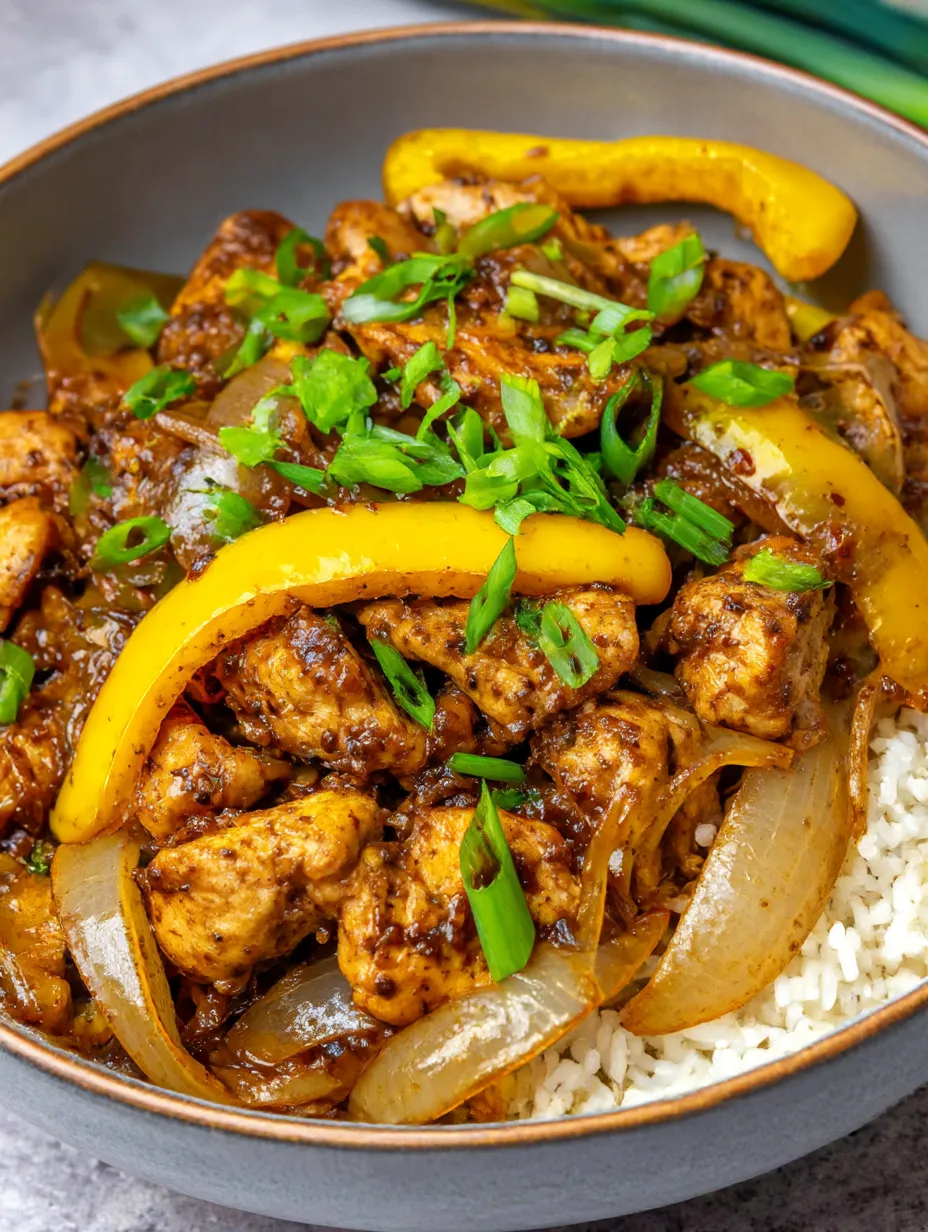 A plate of Chinese black pepper chicken stir fry.