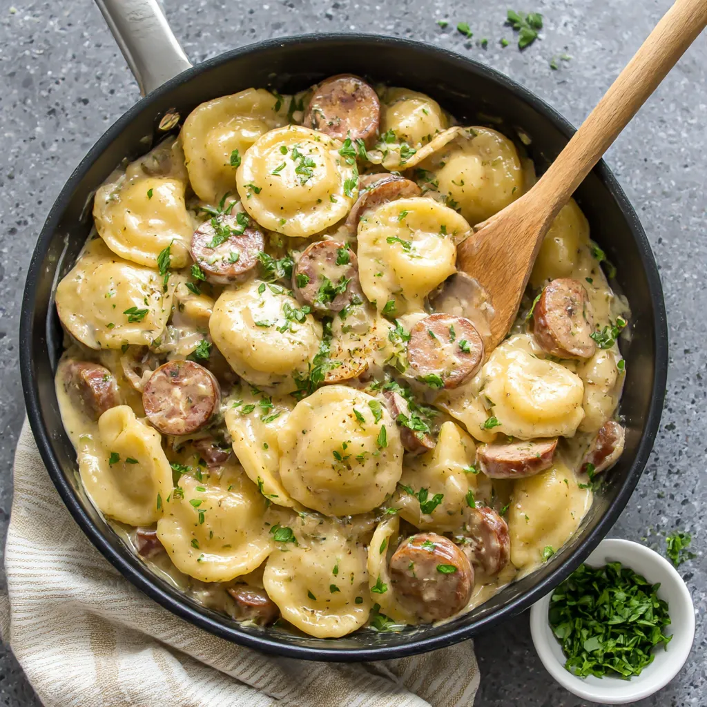 A skillet filled with pasta and sausage.