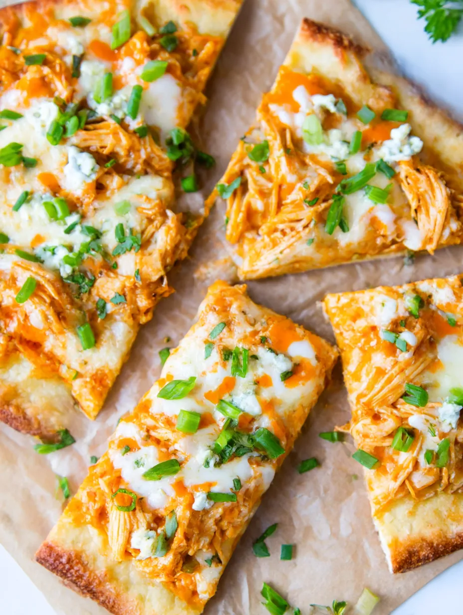 A pizza with chicken and cheese on it.