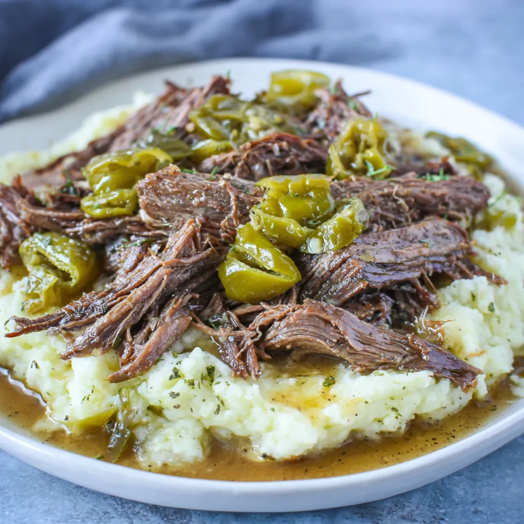A plate of meat and potatoes.