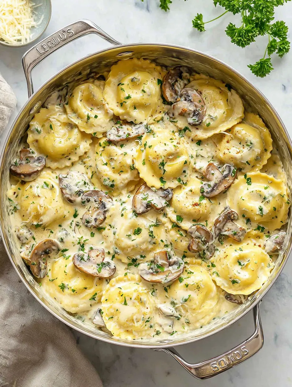 A pan of pasta with mushrooms and herbs.
