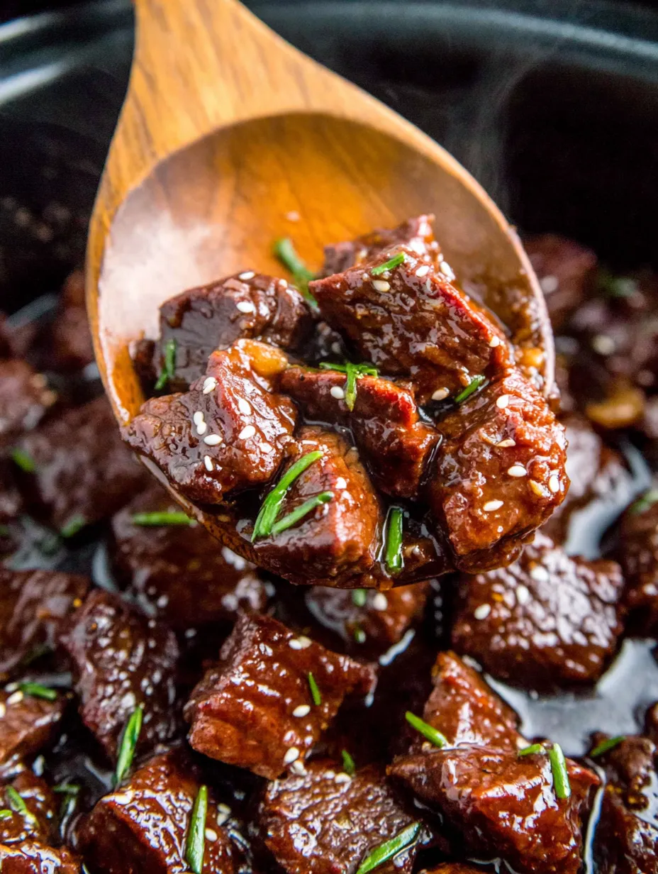 A wooden spoon is filled with meat and herbs.