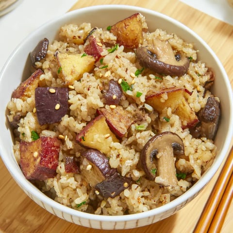 A bowl of rice with mushrooms and sweet potatoes.