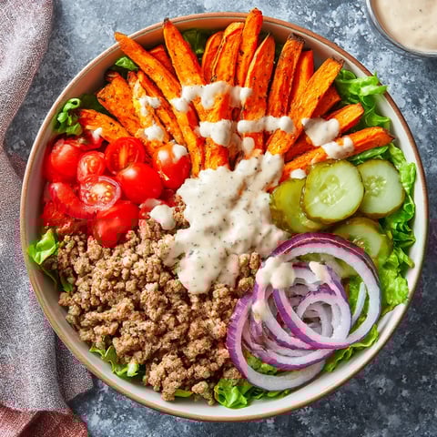 A bowl of food with a variety of ingredients.