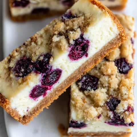 A slice of blueberry crumble cheesecake.