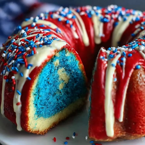 A patriotic bundt cake with red, white and blue frosting.