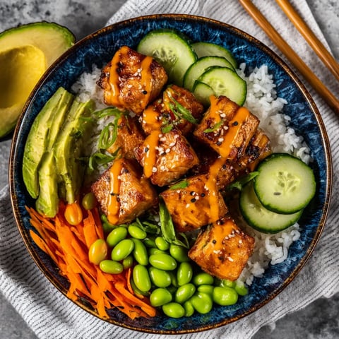 A bowl of food with a fork and a spoon.