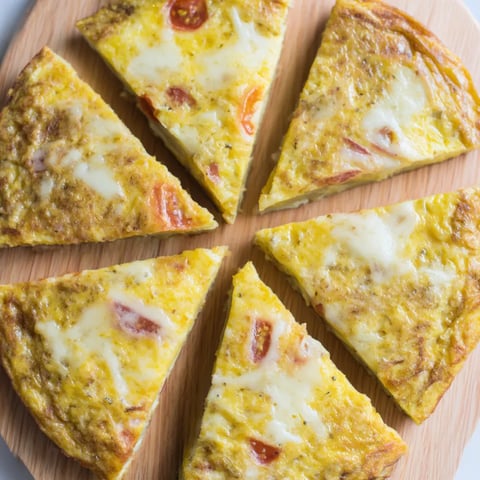 A slice of pizza with eggs on it.