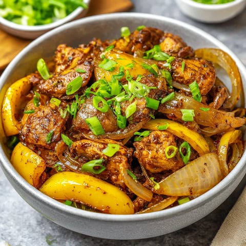A bowl of Chinese black pepper chicken stir fry.
