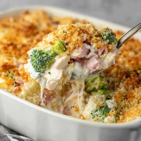 A spoon is in a bowl of food.