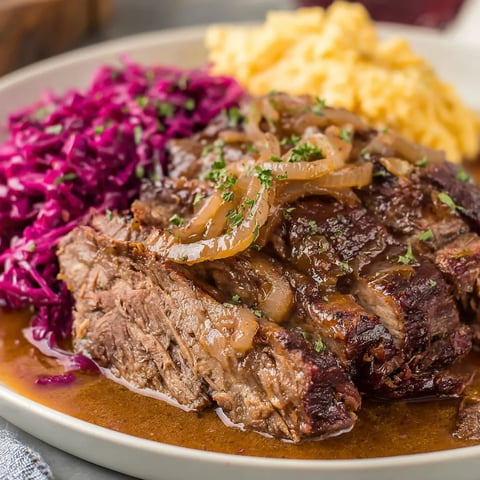 A plate of meat and vegetables.