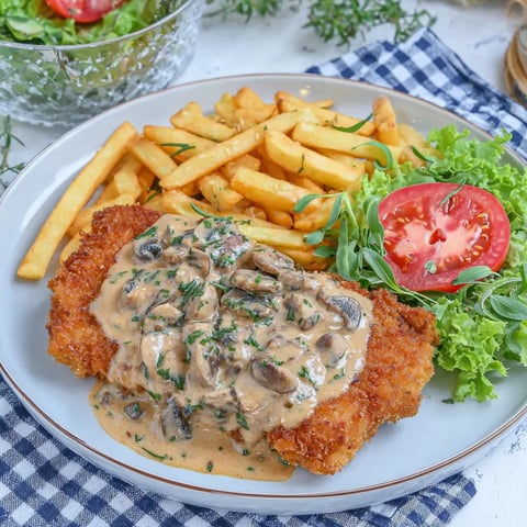 A plate of food with mushrooms, tomatoes, and french fries.