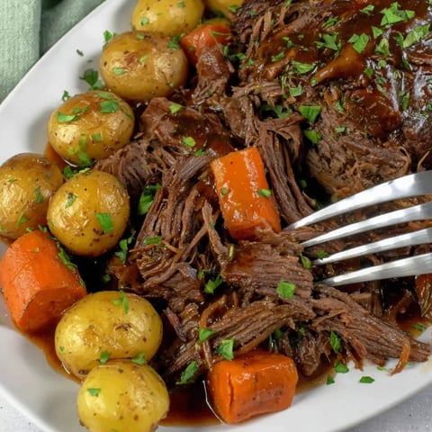 A plate of meat and potatoes.